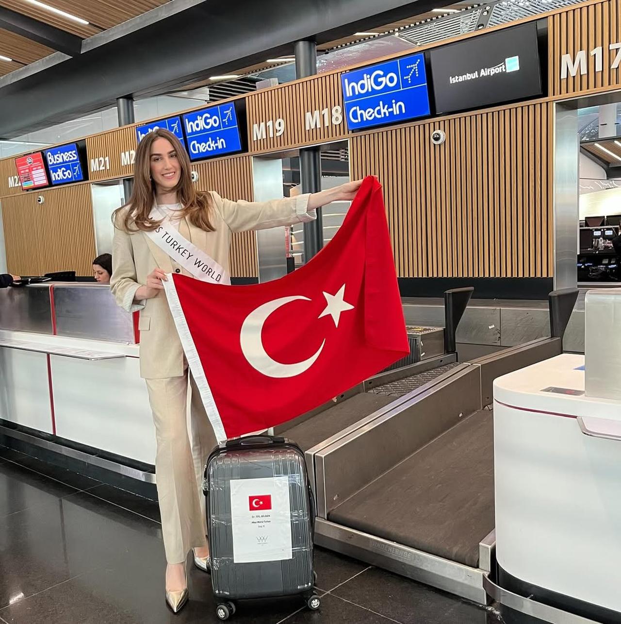 Miss Türkiye 2024 Idil Bilgen poses for photo holding Turkish flag at Istanbul Airport in Türkiye, May 7, 2025. (Photo via Instagram / @idil.bilgen)