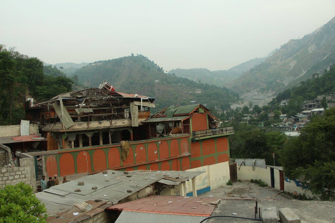 Smoke billows after an artillery shell landed in the main town of Poonch district in Indias Jammu region on May 7, 2025. At least eight Indians were killed and 29 others wounded Wednesday in the town of Poonch in Kashmir, close to the de facto border with Pakistan, a local Indian government official said. (Photo by Punit PARANJPE / AFP)