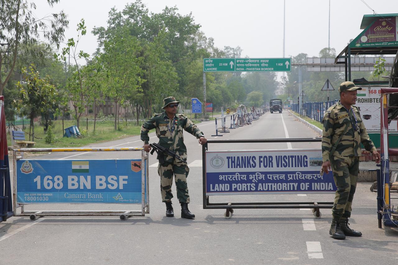 Indian Border Security Force (BSF) security officials stand guard at barricades leading to the border gates between India and Pakistan at Attari border, following India's strike in Pakistan, near Amritsar, India, May 07, 2025. (AA Photo)