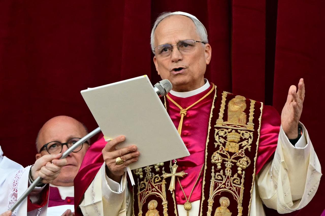 Newly elected Pope Leo XIV, Robert Prevost addresses the crowd on the main central loggia balcony of the St Peter's Basilica for the first time, after the cardinals ended the conclave, in The Vatican, on May 8, 2025. (AFP Photo)