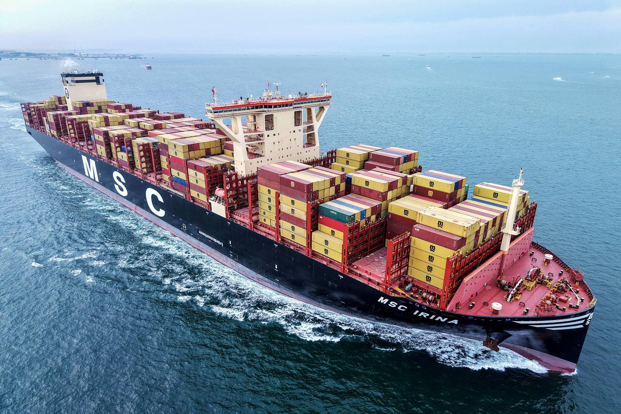 A cargo ship loaded with containers leaves the port in Qingdao, in eastern China's Shandong province on May 7, 2025. (AFP Photo)