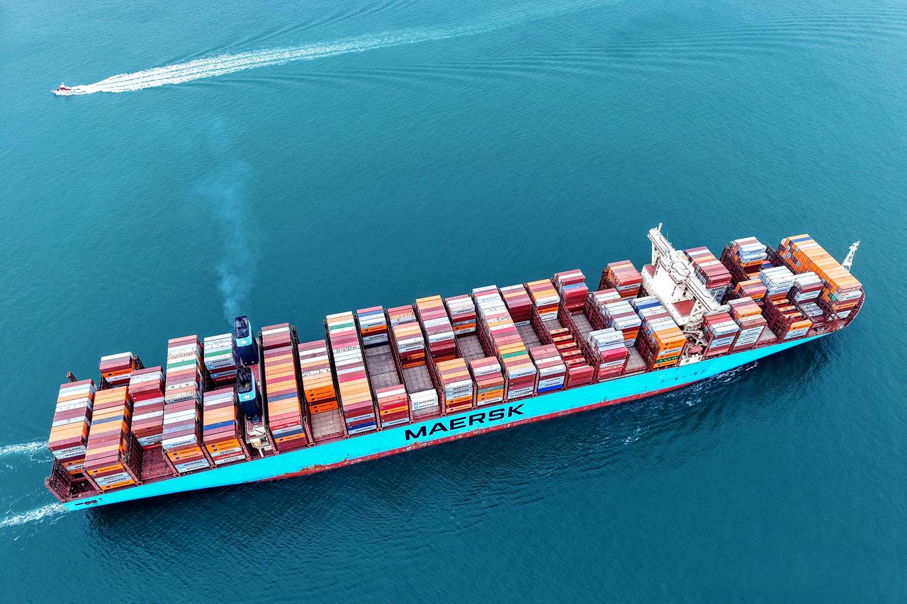 A cargo ship loaded with containers leaves the port in Qingdao, in eastern China's Shandong province on May 7, 2025. (AFP Photo)