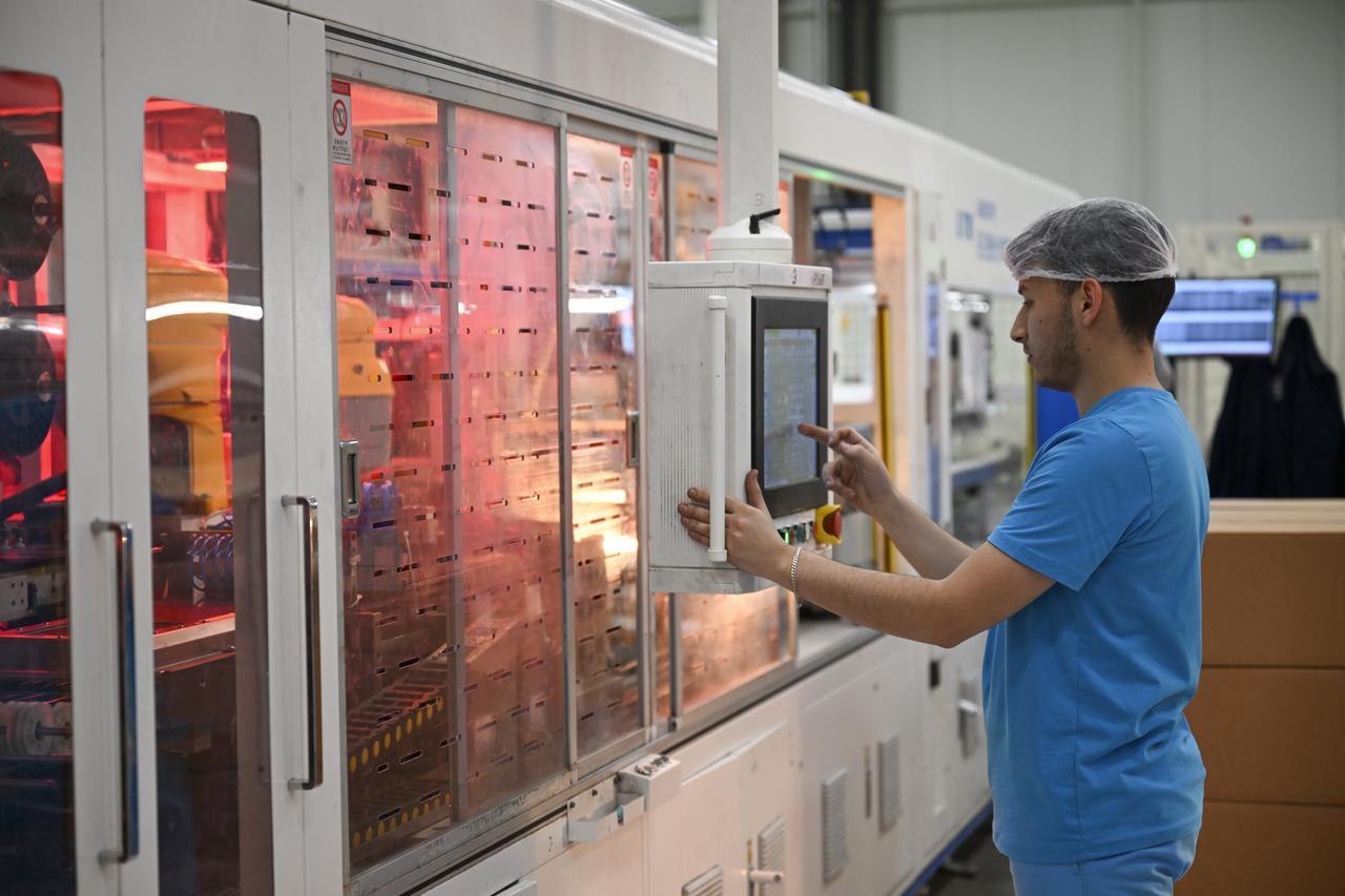 A technician operates a control panel at a solar cell production line in a high-tech manufacturing facility in Sivas, Türkiye, on May 8, 2025. (AA Photo)