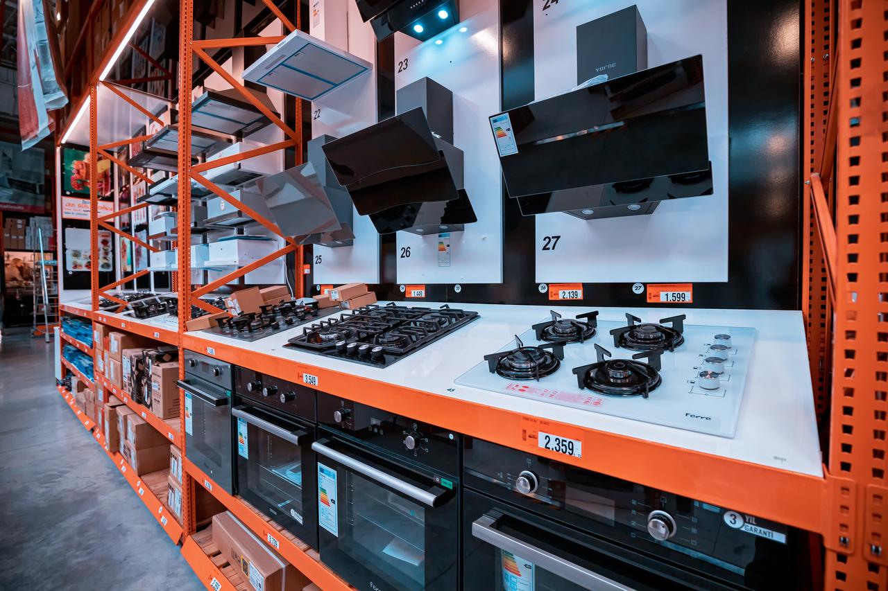 Kitchen appliances including stovetops, ovens, and range hoods are displayed for sale at a home improvement store in Antalya, Türkiye, on June 27, 2022. (Adobe Stock Photo)