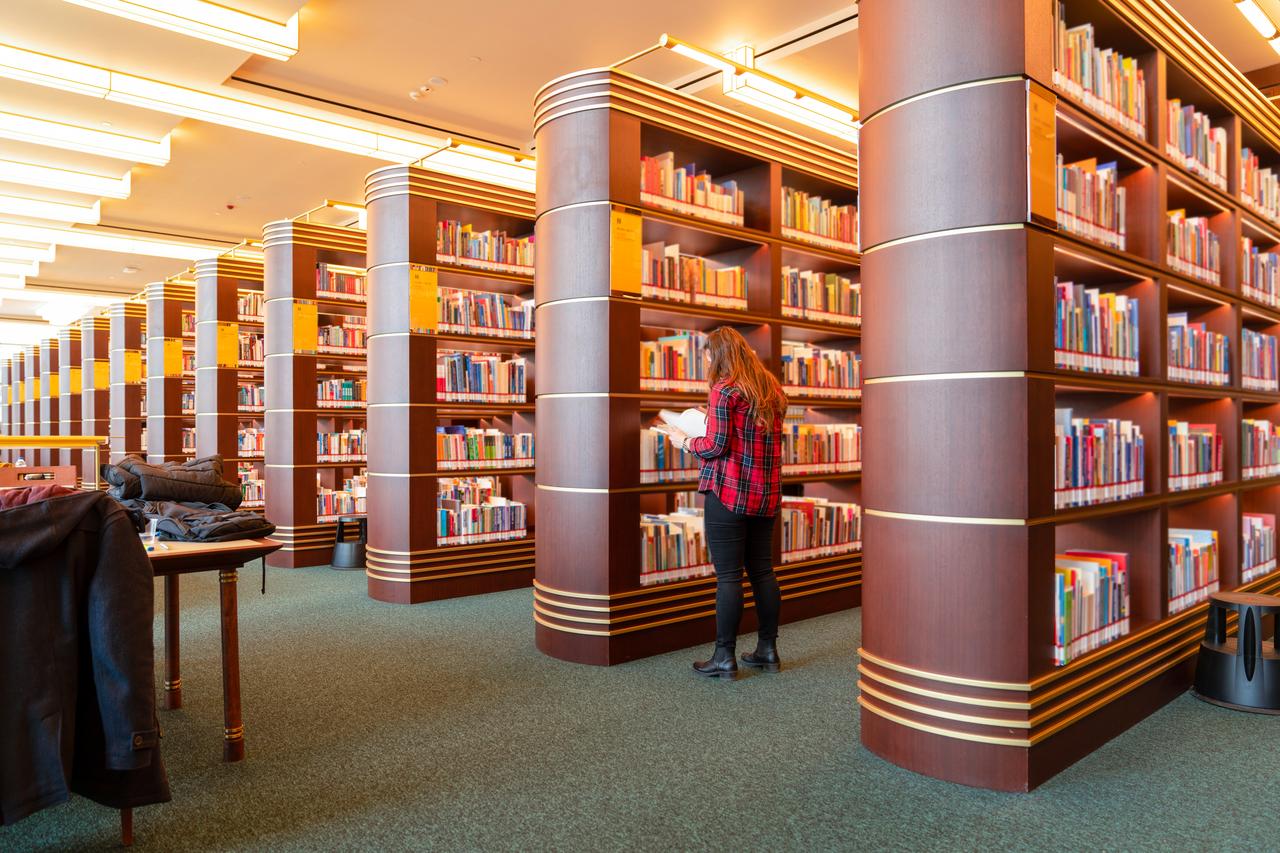 A student browses through books at the Millet Library in Ankara, Türkiye, on February 29, 2020. (Adobe Stock Photo)