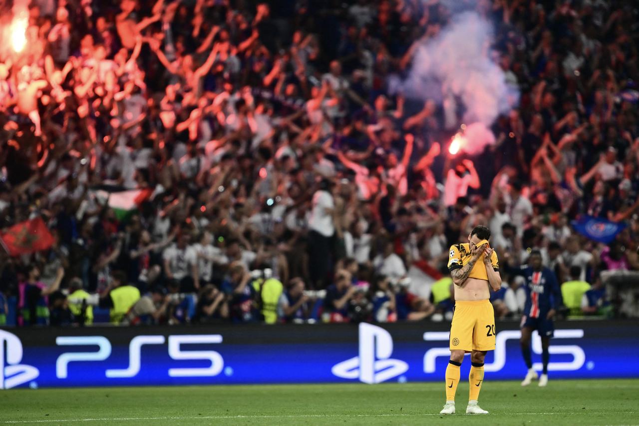 Inter Milan's Turkish midfielder #20 Hakan Calhanoglu reacts after the third goal of Paris Saint-Germain during the UEFA Champions League final football match between Paris Saint-Germain (PSG) and Inter Milan in Munich, southern Germany on May 31, 2025. (AFP Photo)
