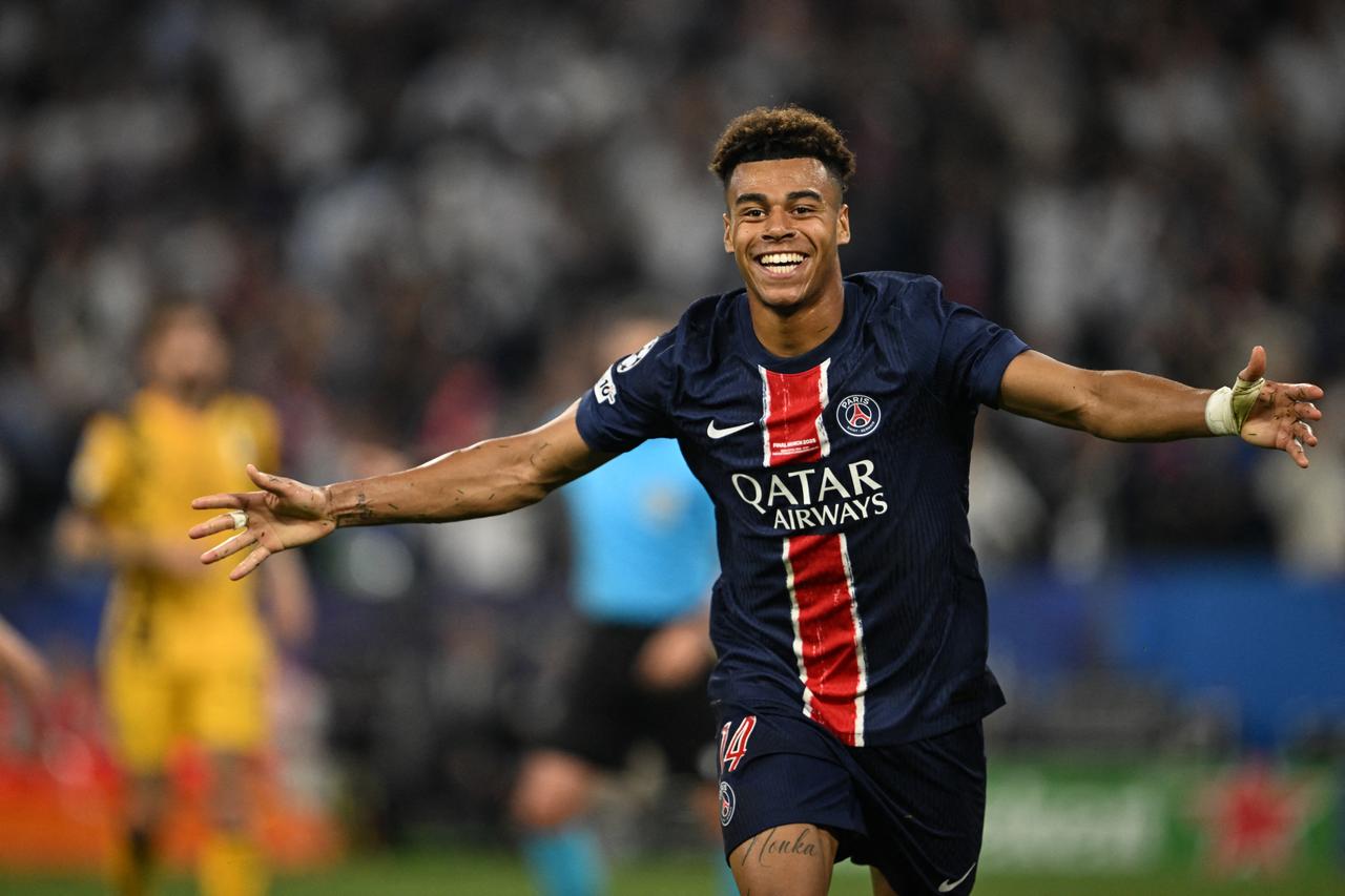 Paris Saint-Germain's French midfielder #14 Desire Doue celebrates after scoring PSGs third goal during the UEFA Champions League final football match between Paris Saint-Germain (PSG) and Inter Milan in Munich, southern Germany, on May 31, 2025. (AFP Photo)