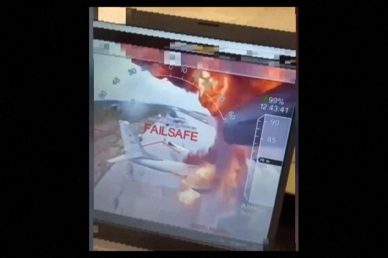 This picture grabed from a video released by the Ukrainian secret services shows what they say are several aircraft on fire on Belaya air base in eastern Siberia, more than 4,200 kilometers from Ukraine on June 1, 2025. (AFP / Security Service of Ukraine Photo)