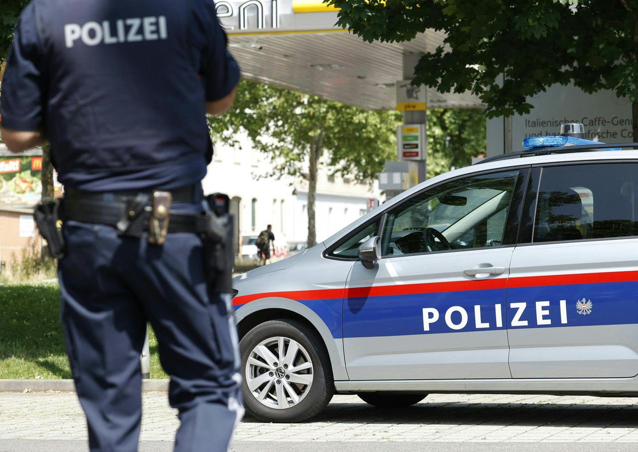 A policeman is seen close to a school where, according to reports, several people died in a shooting, on June 10, 2025 in Graz, southeastern Austria. (AFP Photo)