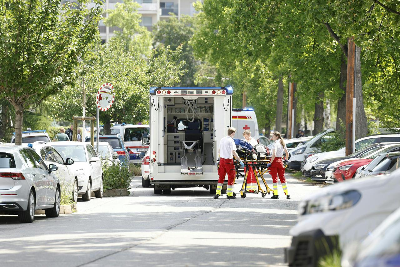 Rescue paramedics are seen next to an ambulance car close to a school where, according to reports, several people died in a shooting, on June 10, 2025 in Graz, southeastern Austria. (AFP Photo)