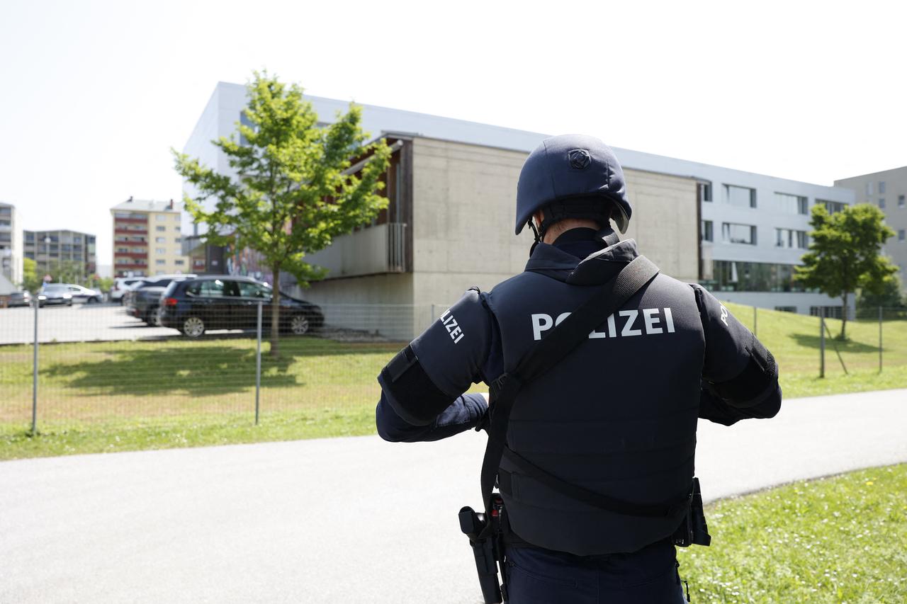 A policeman is seen close to a school where, according to reports, several people died in a shooting, on June 10, 2025 in Graz, southeastern Austria. (AFP Photo)