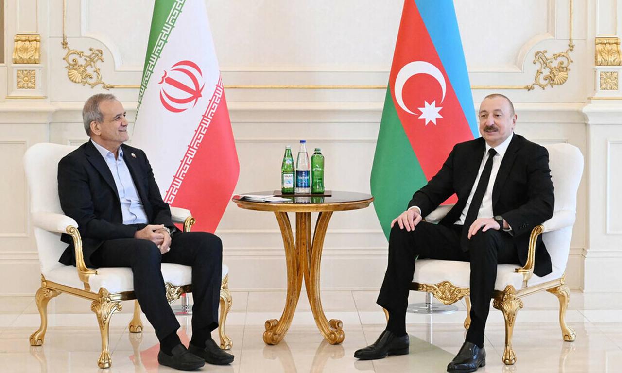 In this handout picture taken and released by the Azerbaijani presidency on April 28, 2025, Azeri President Ilham Aliyev meets with his Iranian counterpart Masoud Pezeshkian in Baku. (Photo by Handout / Azerbaijani presidency / AFP)