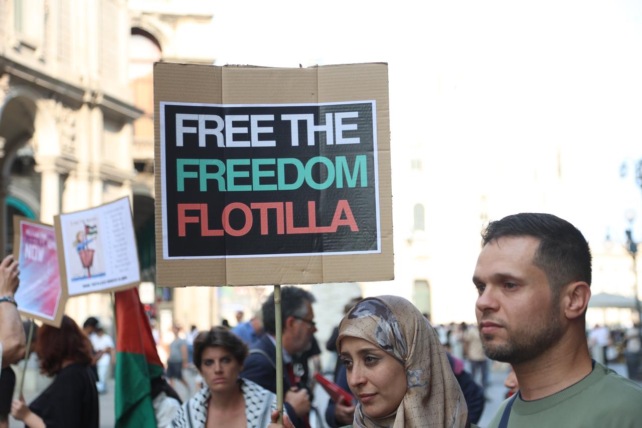 Demonstrators, holding Palestinian flags and banners, gather in two separate demonstrations in front of the Duomo Cathedral and the Milan Prefecture to protest Israel’s interception of the civilian aid ship “Madleen,” which was en route to deliver humanitarian assistance to Gaza on June 09, 2025 in Milan, Italy. (AA Photo)