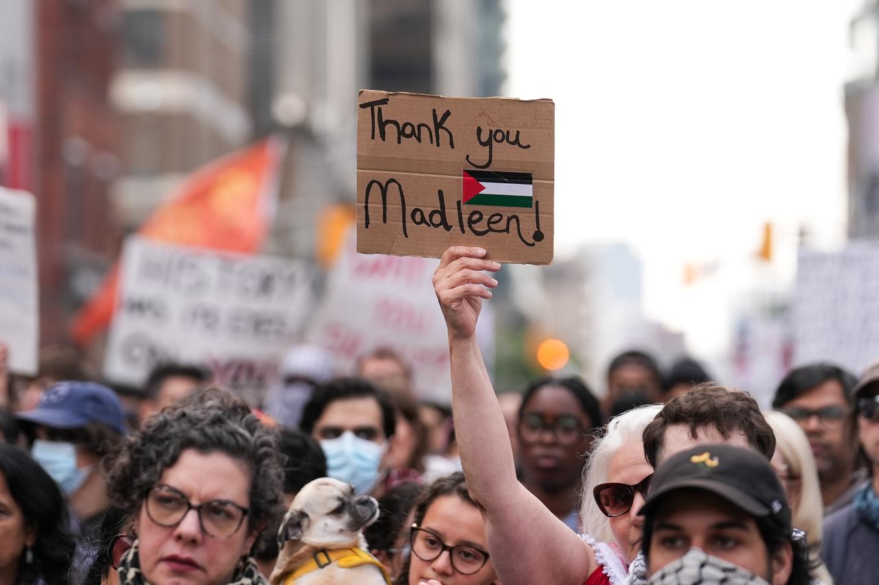 People holding Palestinian flags and banners take part in a protest against Israel’s interception of the aid ship ‘Madleen’ in Toronto, Ontario on June 9, 2025. (AA Photo)