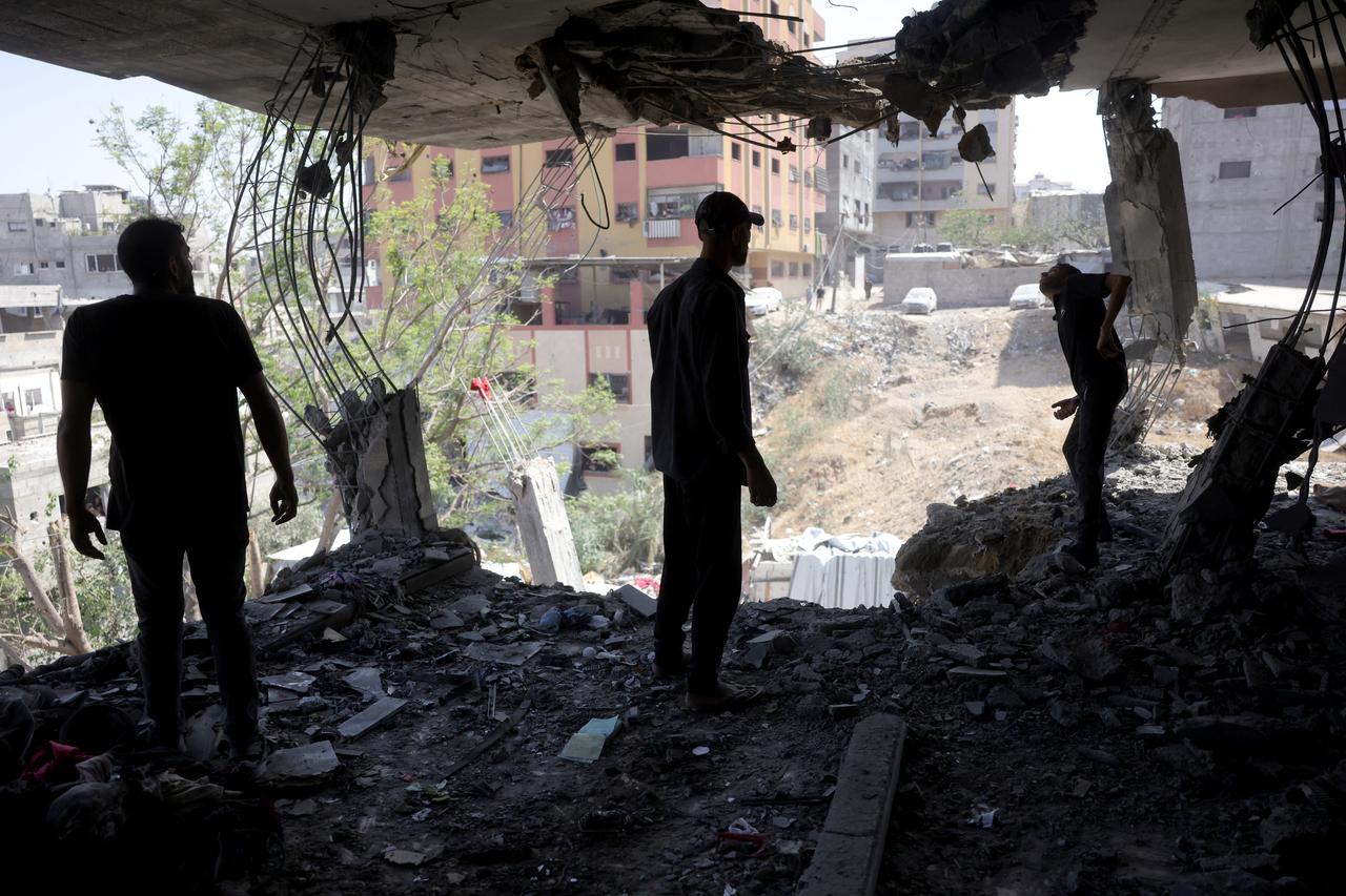 Palestinians inspect the damage in the rubble of the Shaheen family home, in the Saftawi neighbourhood, west of Jabalia, in the northern Gaza Strip, after it was targeted in an Israeli strike on June 9, 2025. (AFP Photo)