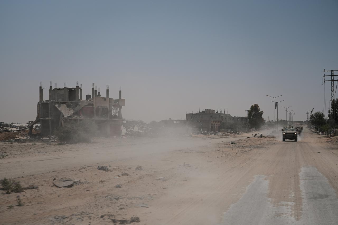 This picture taken on June 8, 2025, shows Israeli military vehicles as they drive along Salaheddin Road, during a controlled embed organised by the Israeli military in Khan Yunis in the Gaza Strip. (AFP Photo)