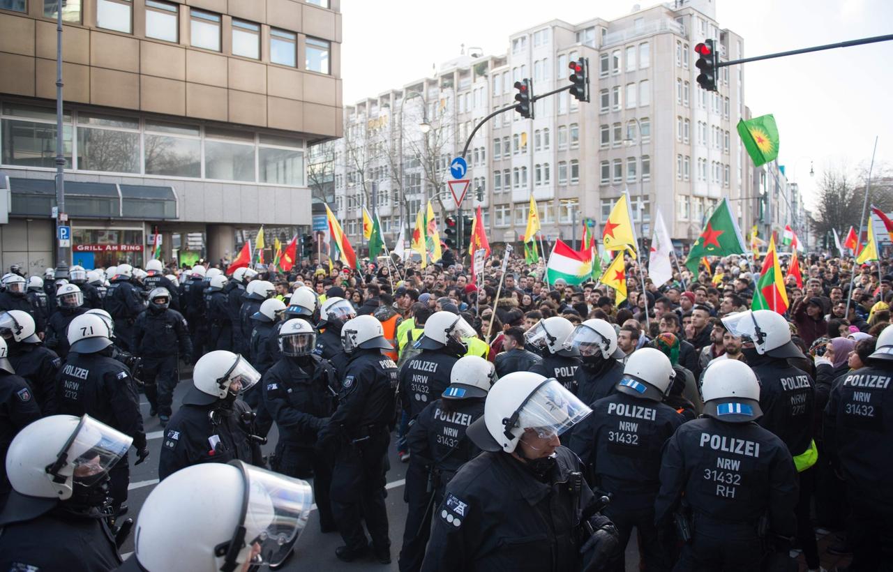 Police officers stop terrorist group PKKs sympathizers in a mass demonstration in Cologne, western Germany on Jan. 27, 2018. (AFP Photo)