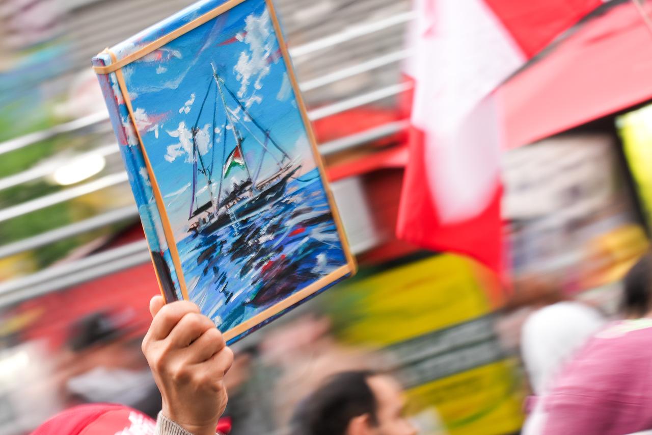 People holding Palestinian flags and banners take part in a protest against Israel’s interception of the aid ship ‘Madleen’ in Toronto, Ontario on June 9, 2025. (AA Photo)