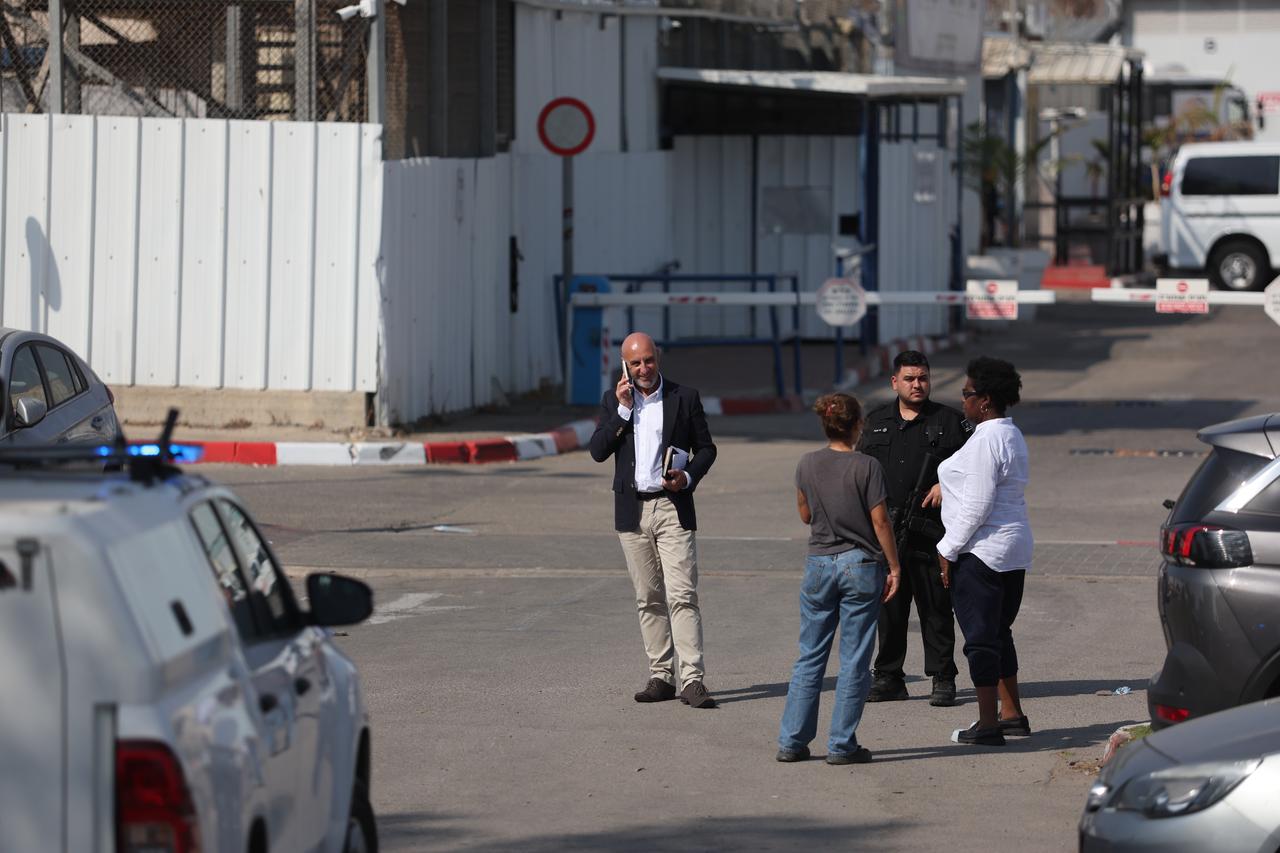 Personnel from the French Embassy in Tel Aviv wait outside Givon Prison facility where 12 activists were reportedly taken after being detained aboard the Madleen vessel, which was carrying humanitarian aid to Gaza, in the city of Ramla, Israel on June 10, 2025. (AA Photo)