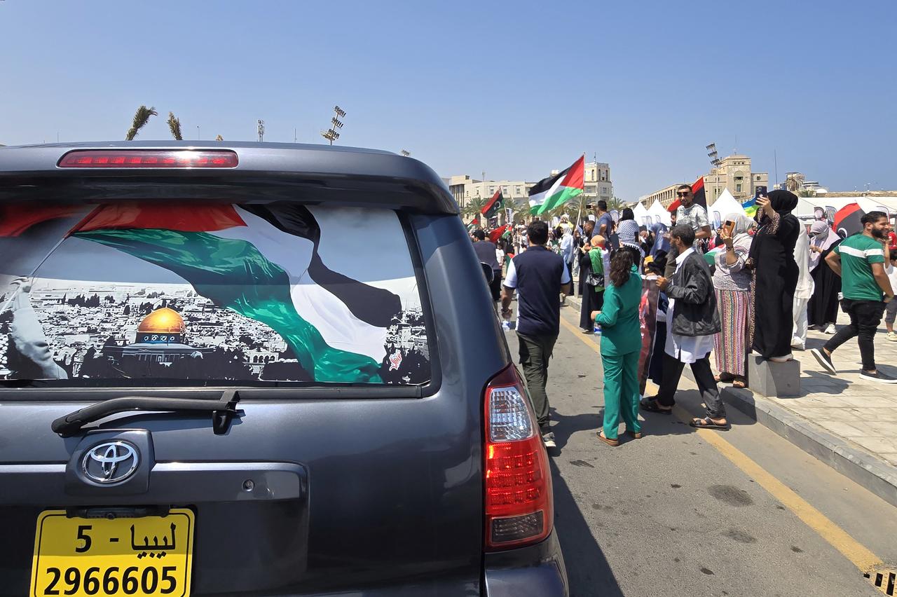 Activists, heading towards Gaza by land with the aim of breaking the siege on the Palestinian territory, are greeted by Libyans in Tripolis Martyrs Square on June 11, 2025. (AFP Photo)