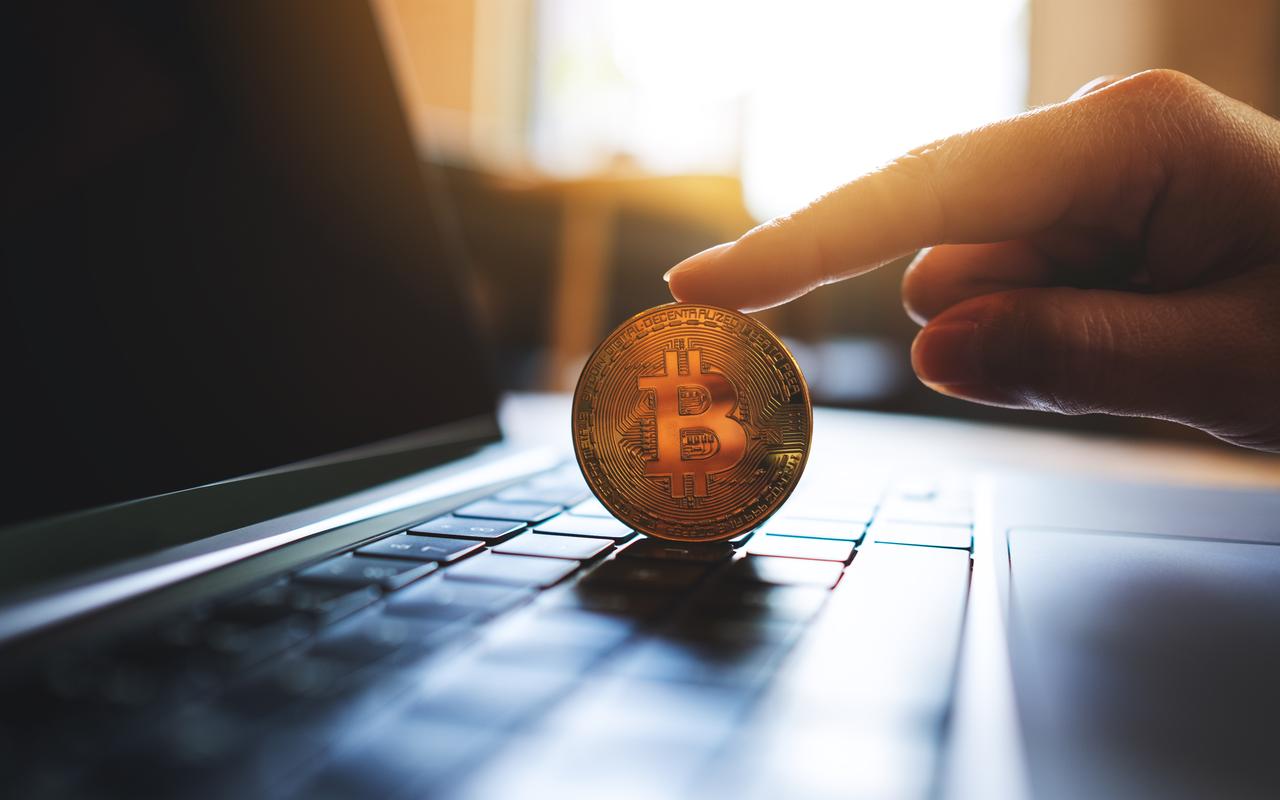 A symbolic Bitcoin coin is placed on a laptop keyboard, accessed on June 11, 2025. (Adobe Stock Photo)