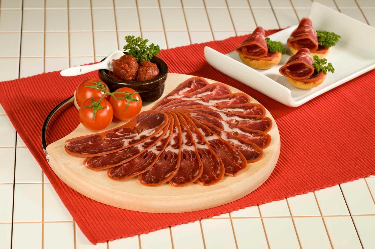 Slices of pastirma served differently on table. (Adobe Stock Photo)