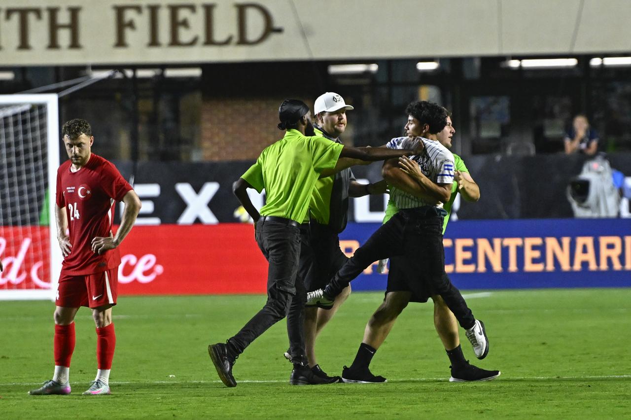 Fans enter the field during the friendly match between Turkiye and Mexico at Kenan Memorial Stadium at Chapel Hill, North Carolina, United States on June 10, 2025. (AA Photo)
