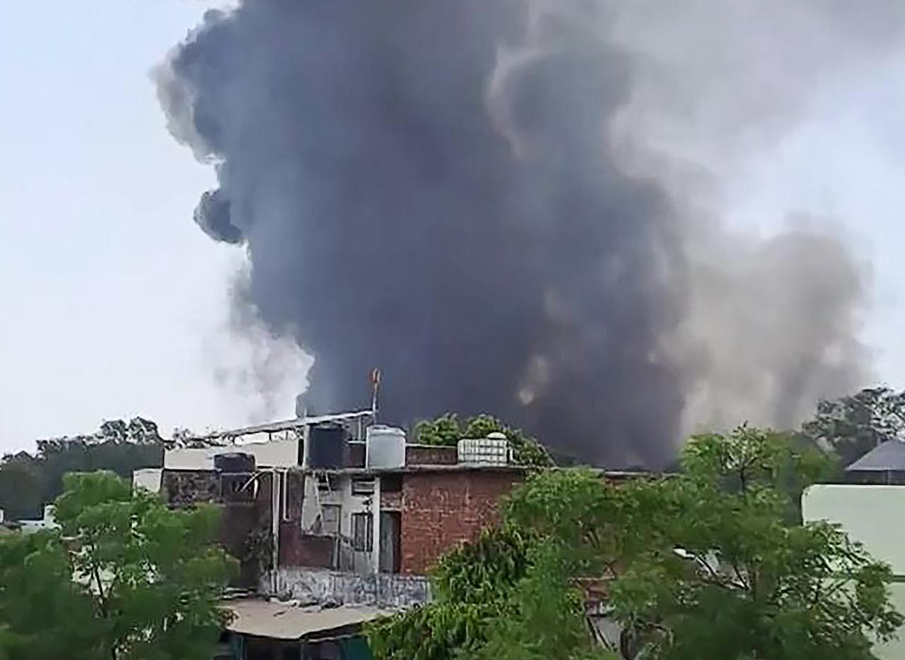 Plume of smoke rising after Air India flight 171 crashed near the airport in Ahmedabad on June 12, 2025. (AFP PHOTO /@ASHLOVETEA/ESN VIA AFPTV)