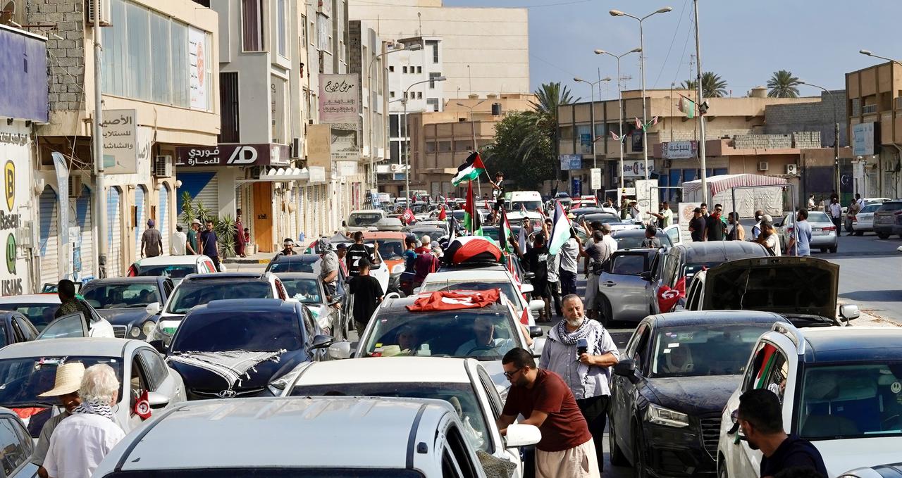 ZLITEN, LIBYA - JUNE 12: Hundreds of residents in Zliten, Libya, see off the Maghreb Resistance Convoy, on June 12, 2025. Streets flood with Libyan and Palestinian flags, while chants demand an end to the Gaza blockade. ( Hazem Turkia - Anadolu Agency )