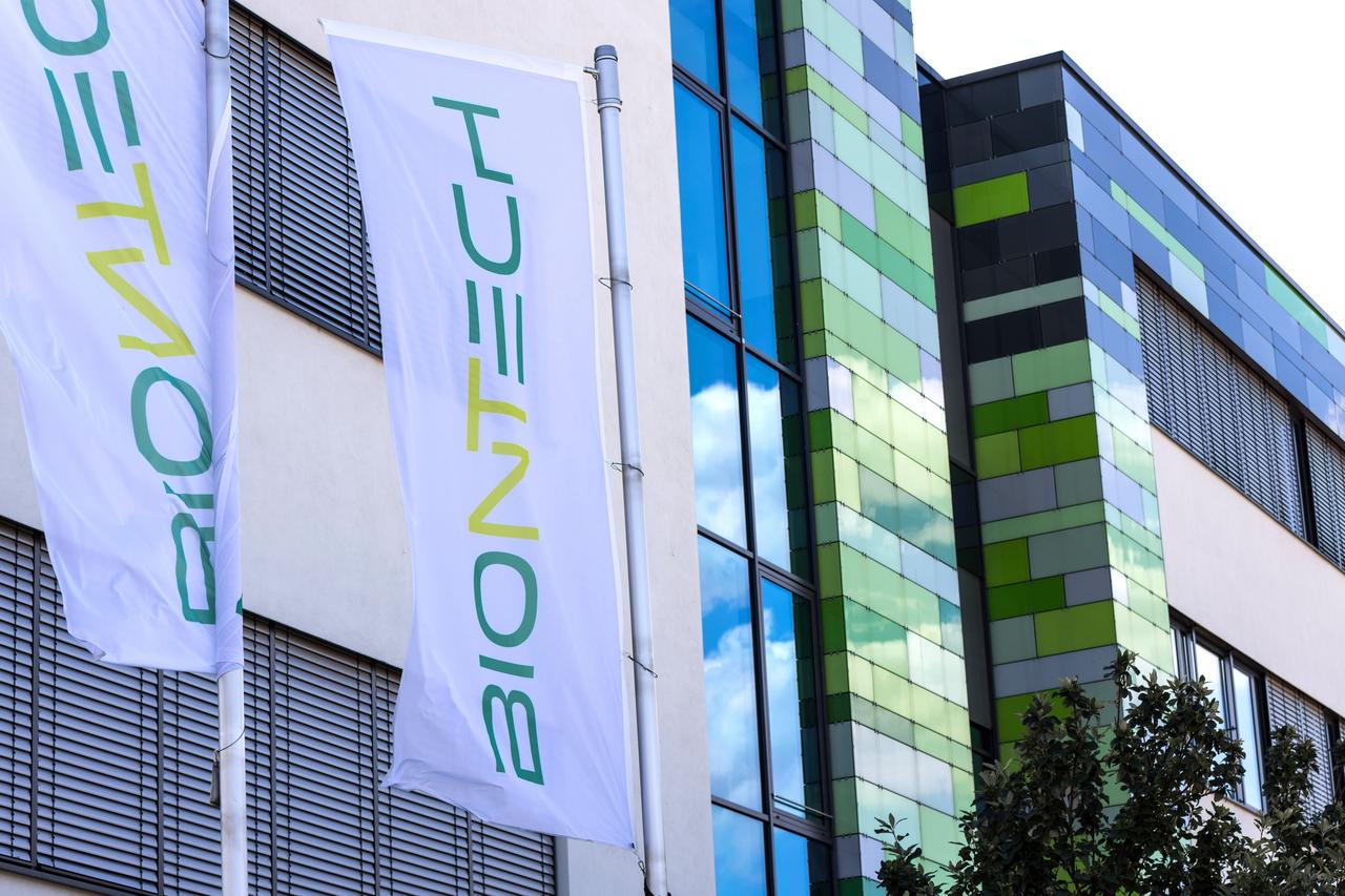 Flags bearing the BioNTech logo are seen outside the companys headquarters in Mainz, Germany, on July 16, 2025. (Adobe Stock Photo)