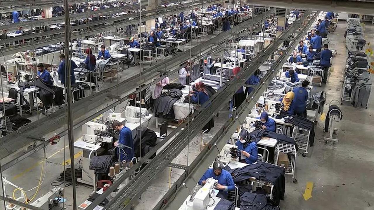 File photo shows workers operating sewing machines in a bustling textile facility in Türkiye. (AA Photo)