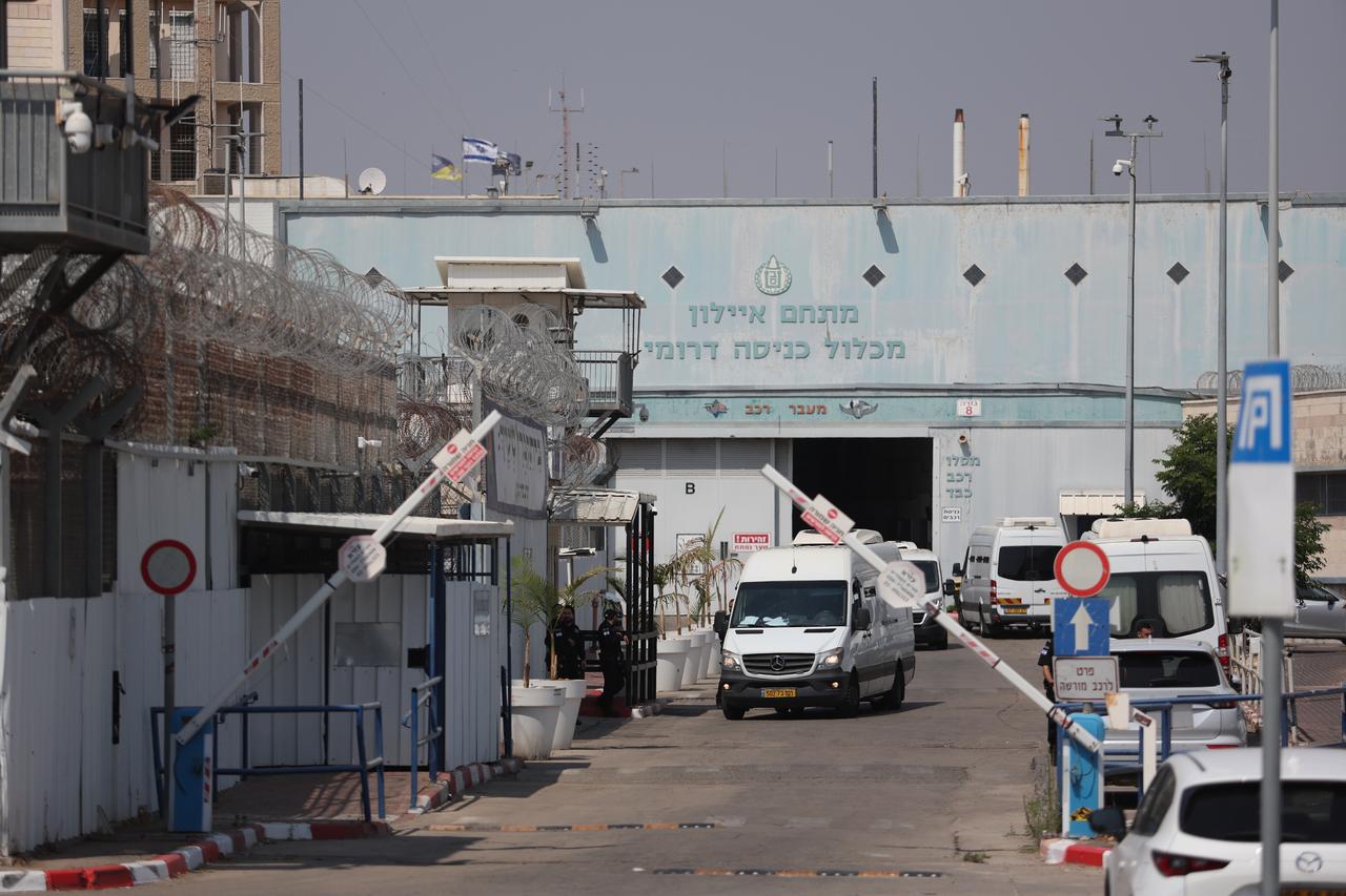 Personnel from the French Embassy in Tel Aviv wait outside Givon Prison facility where 12 activists were reportedly taken after being detained aboard the Madleen vessel, which was carrying humanitarian aid to Gaza, in the city of Ramla, Israel on June 10, 2025. (AA Photo)
