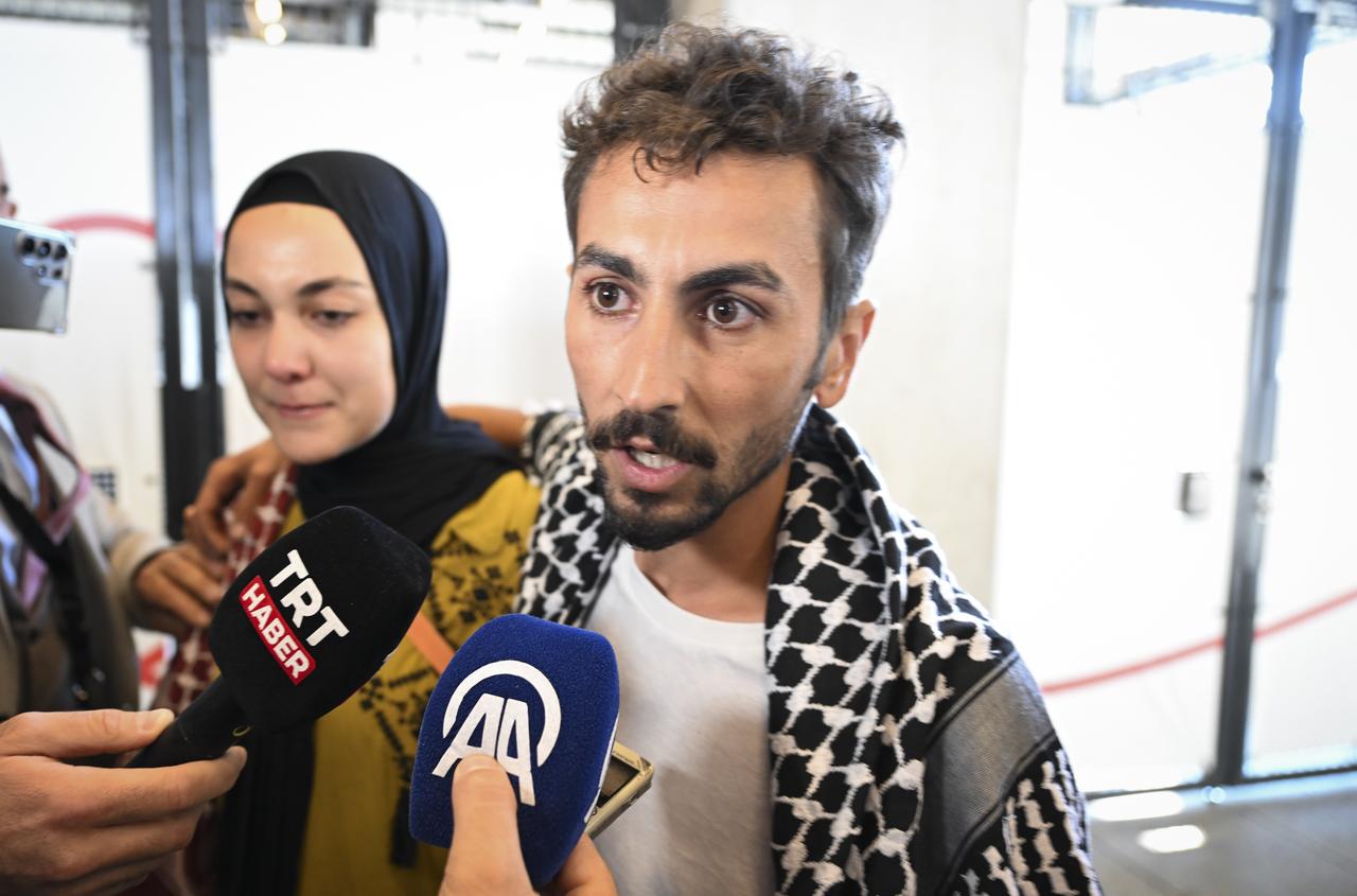 Turkish citizen Suayb Ordu, who was aboard the vessel Madleen when it was intercepted by Israeli forces, speaks to the press after arriving in Berlin, Germany, Jun. 12, 2025. (AA Photo)