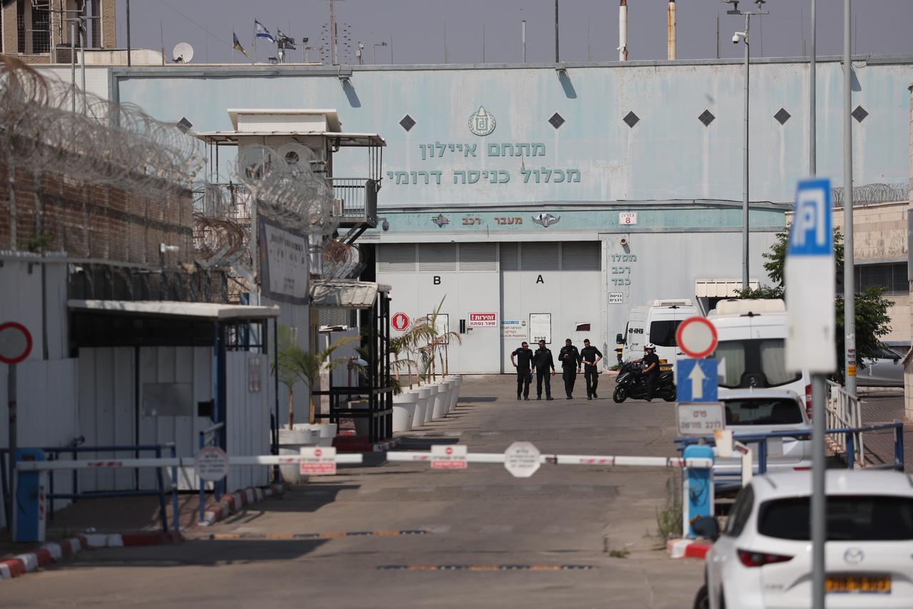 Personnel from the French Embassy in Tel Aviv wait outside Givon Prison facility where 12 activists were reportedly taken after being detained aboard the Madleen vessel, which was carrying humanitarian aid to Gaza, in the city of Ramla, Israel on Jun. 10, 2025. (AA Photo)