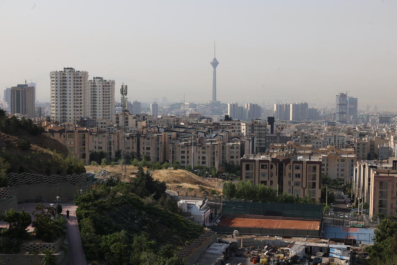 A general view shows part of the Iranian capital Tehran with its landmark Milad Tower in the centre, on June 13, 2025. (AFP Photo)