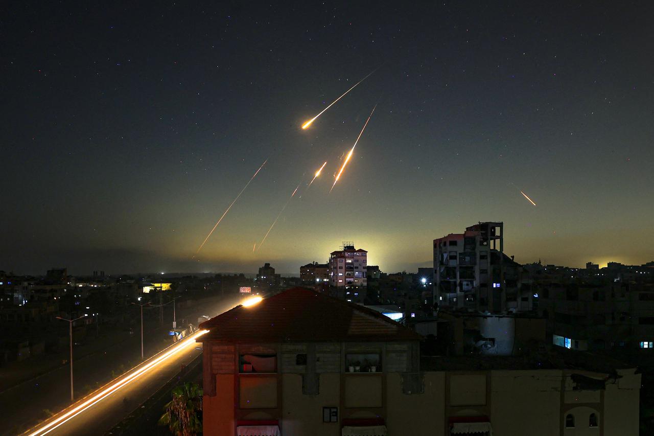 This picture taken from Nuseirat, in the central Gaza Strip, shows rocket trails in the sky late on June 13, 2025. (AFP Photo)