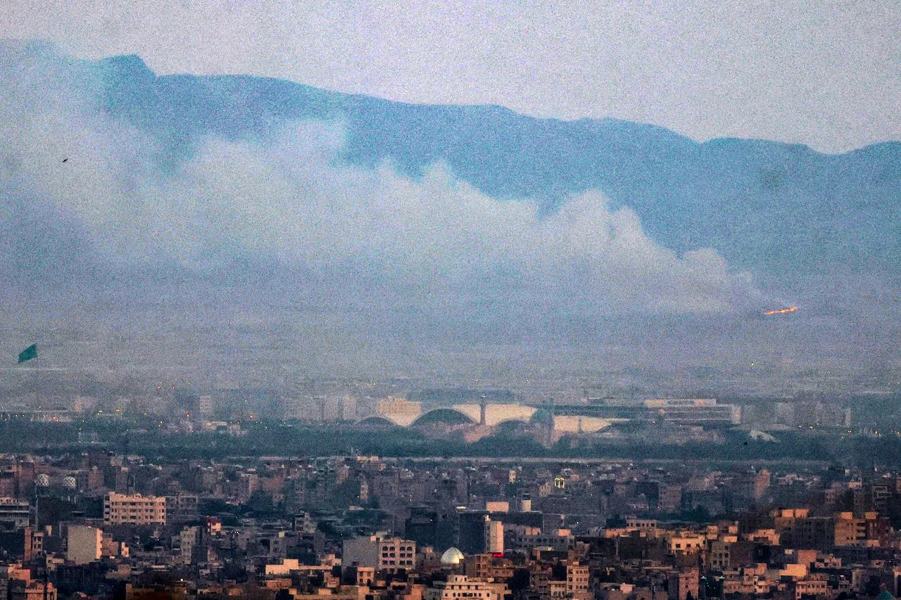 Smoke and fire billow from the site of an alleged Israeli strike in southern Tehran on June 13, 2025. (AFP Photo)