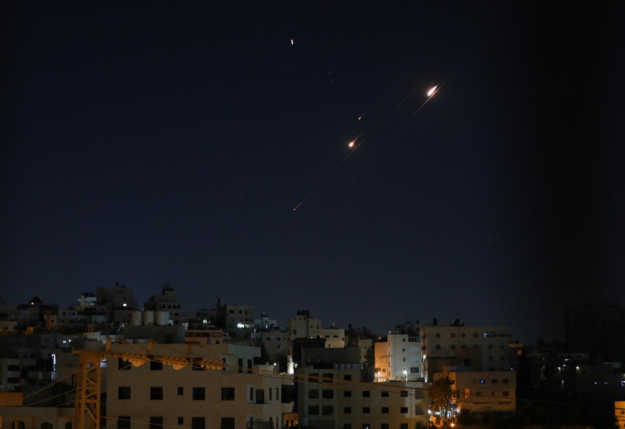  A ballistic missile fired by Iran is seen streaking across the night sky over Hebron, in the southern West Bank, during continued attacks targeting various Israeli cities, on June 14, 2025. (AA Photo)