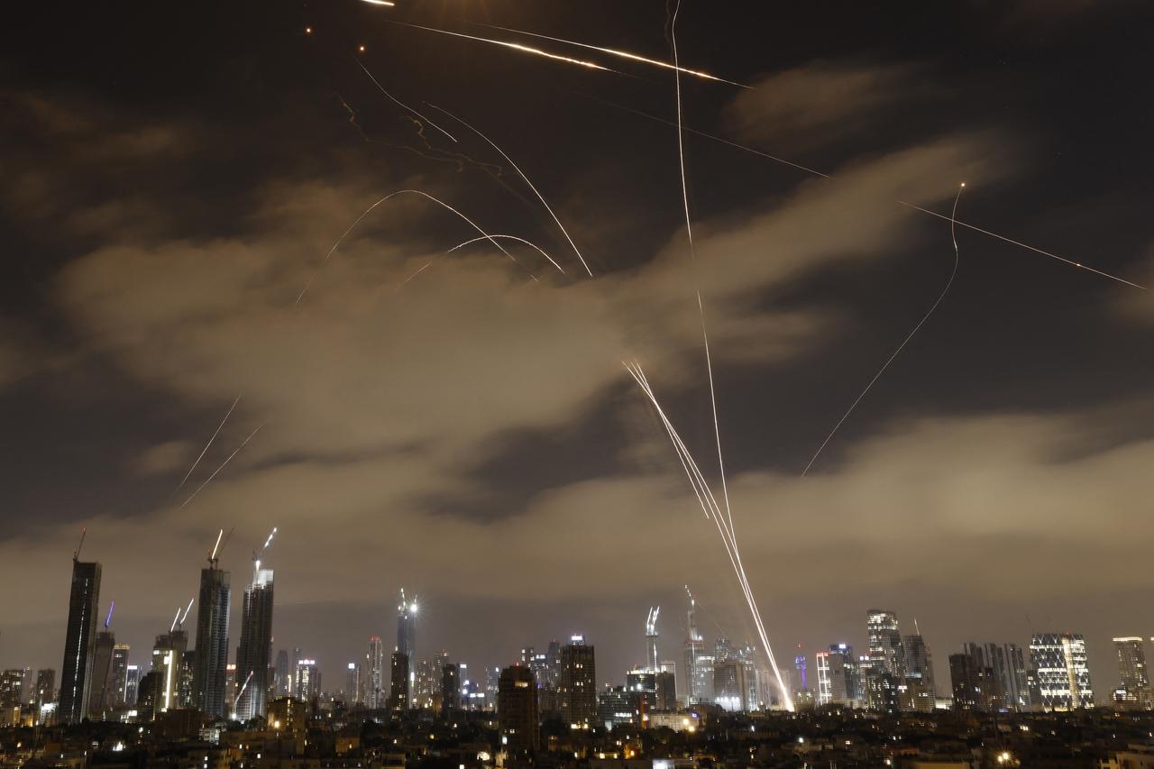 Israeli air defence systems intercept Iranian missiles over the Israeli city of Tel Aviv early on June 15, 2025. (AFP Photo)