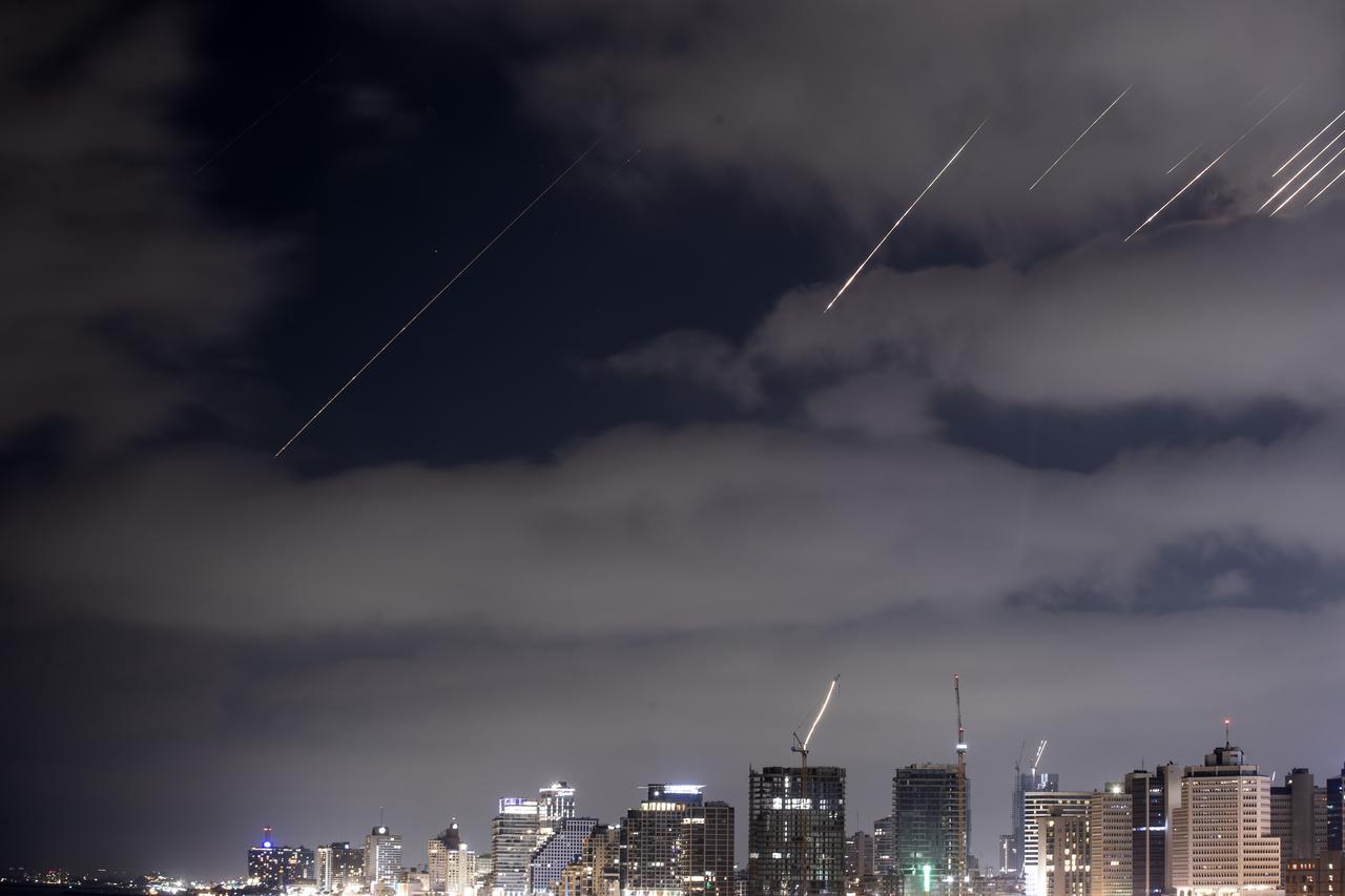 Ballistic missiles launched by Iran as part of renewed retaliatory attacks are seen in the skies over Tel Aviv, Israel, on June 14, 2025. (AA Photo)