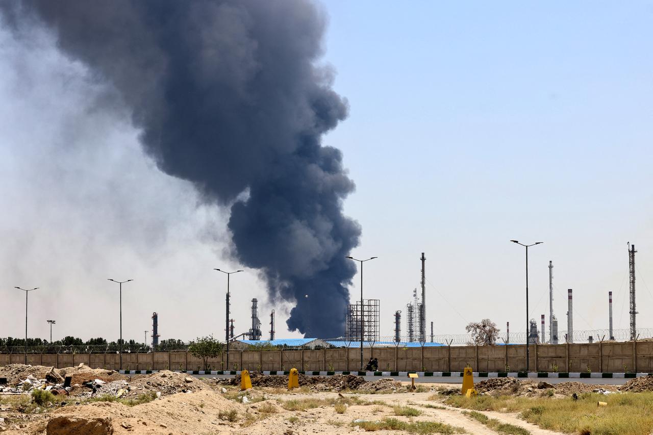 A plume of heavy smoke and fire rise over an oil refinery in southern Tehran, after it was hit in an overnight Israeli strike, on June 15, 2025. (AFP Photo)