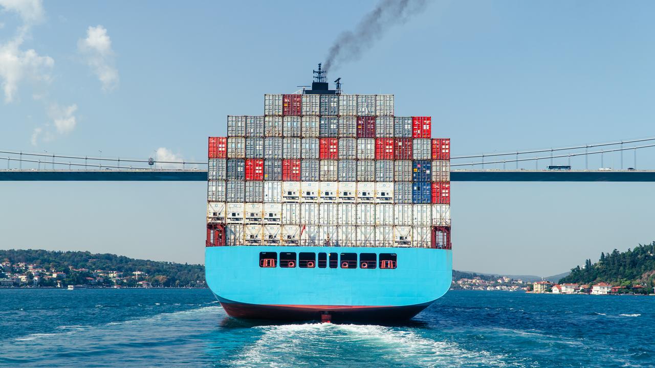 Rear view of a fully loaded container ship passing beneath the Fatih Sultan Mehmet Bridge on the Bosporus Strait in Istanbul, Türkiye, accessed on June 15, 2025. (Adobe Stock Photo)