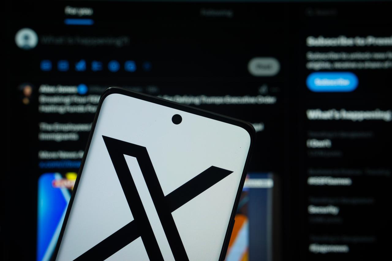 Photo illustration shows a smartphone displaying the logo of X in front of the platform’s interface, taken in Dhaka, Bangladesh, on March 11, 2025. (Adobe Stock Photo)
