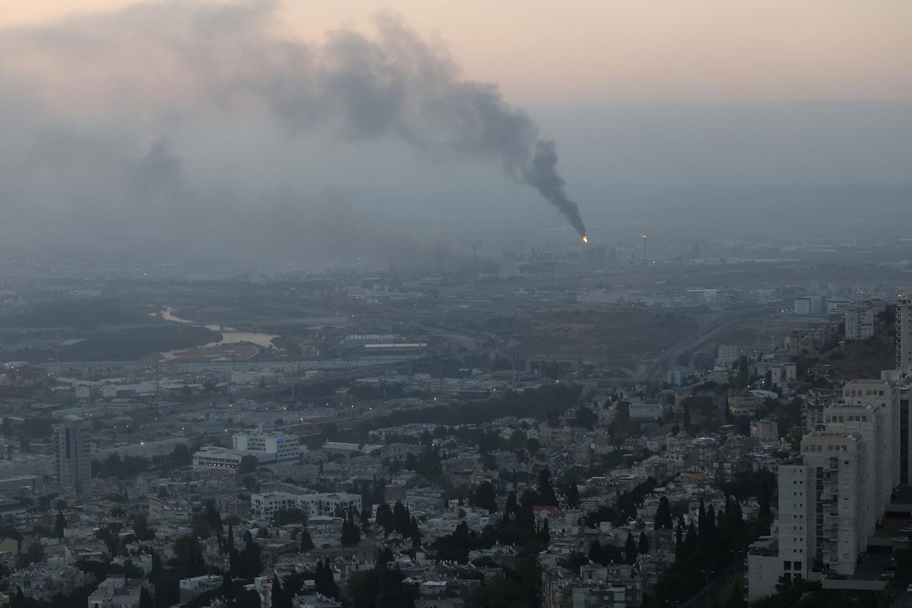 Smoke billows from a site, which was hit during the Iranian missile strikes, in the city of Haifa early on June 16, 2025. (AFP Photo)