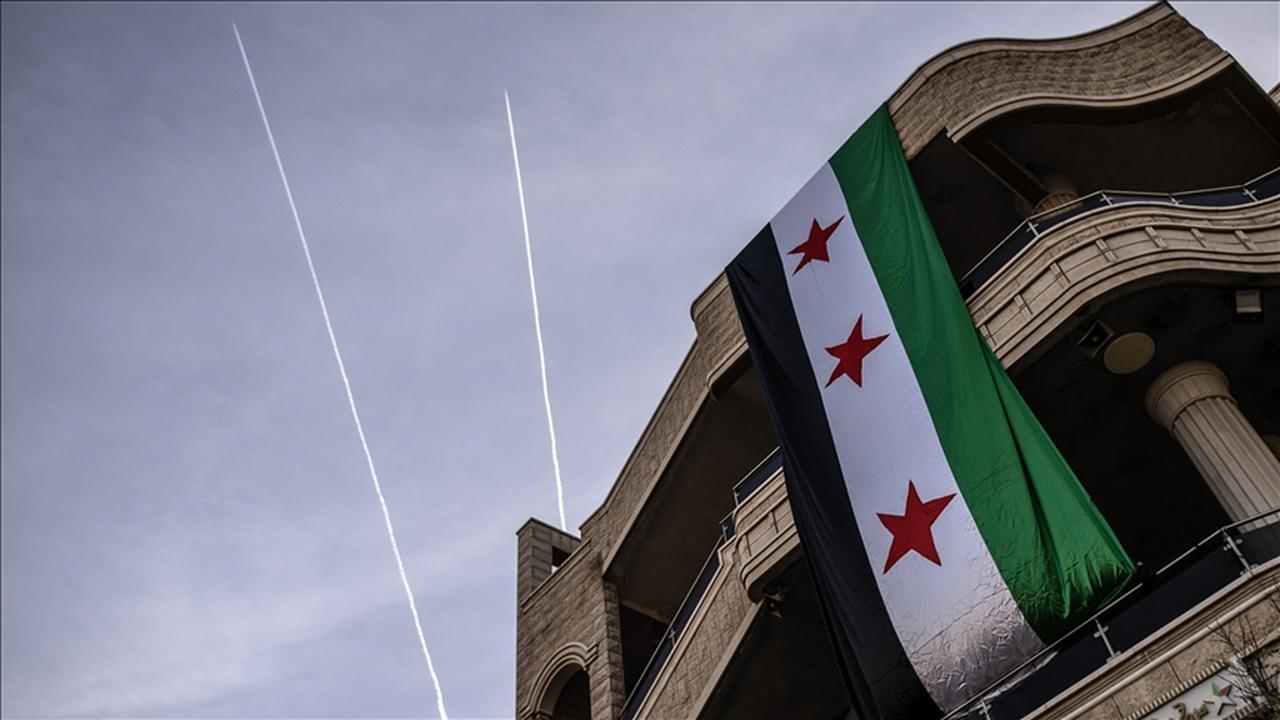 A large Syrian opposition flag hangs from a building in northern Syria, accessed on June 16, 2025. (AA Photo)