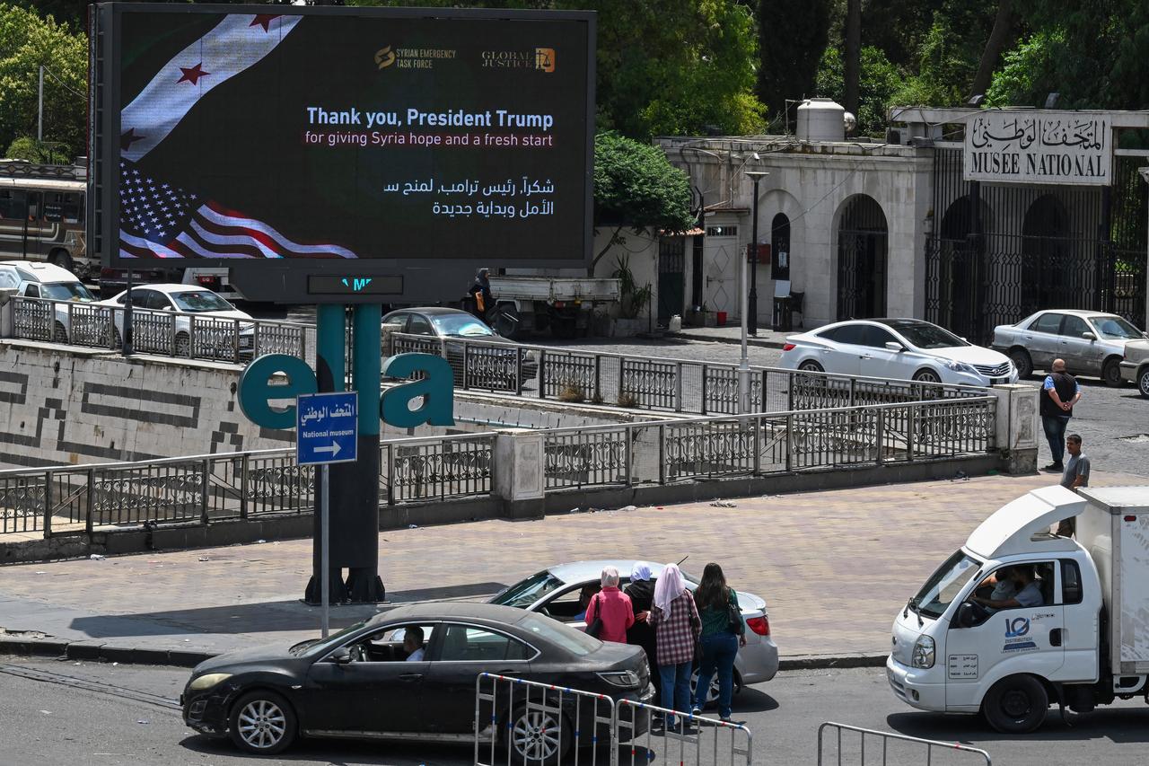 An advertisement billboard thanking US President Donald Trump is set up on a major traffic axis in Damascus on June 11, 2025. (AFP Photo)