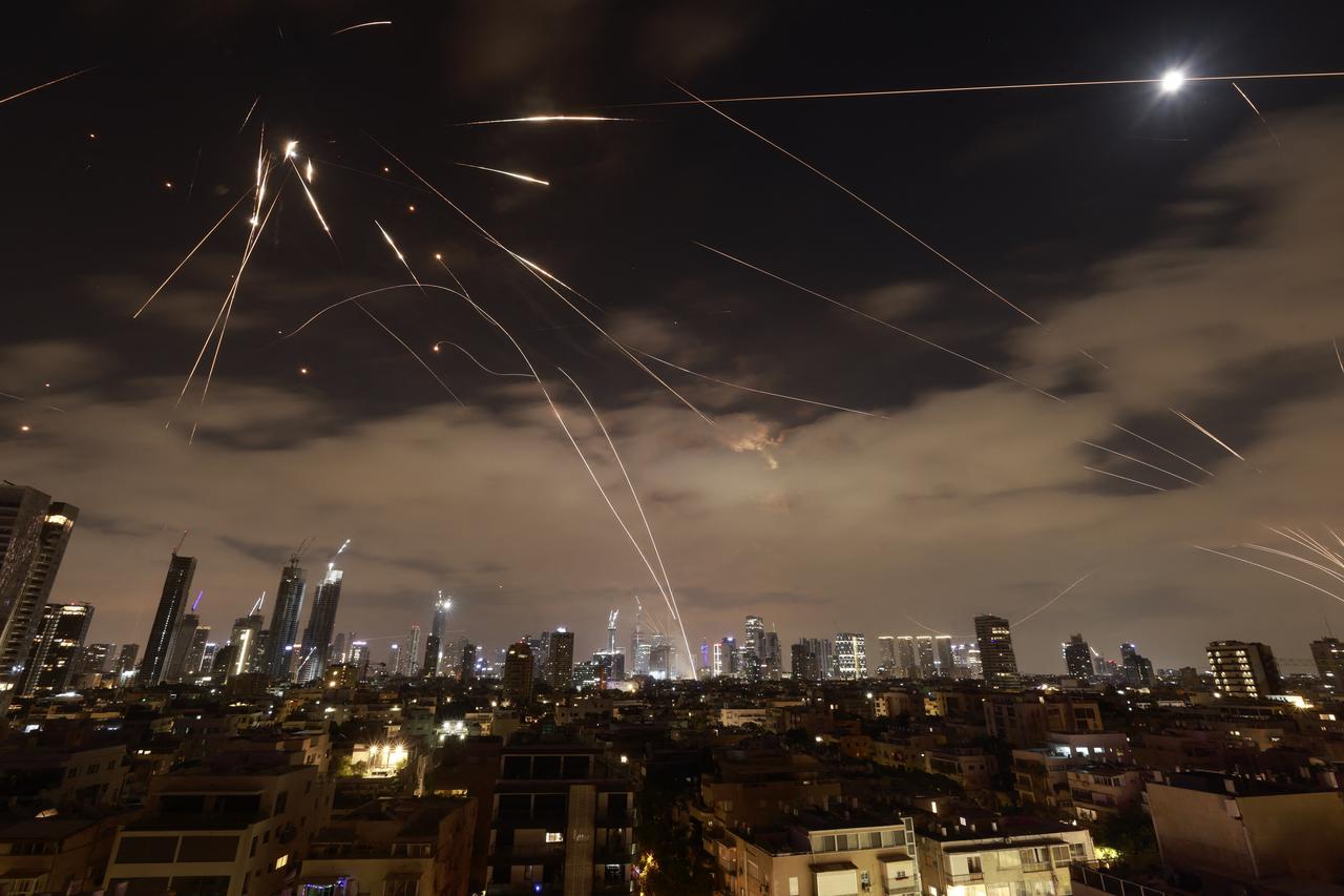Israeli air defence systems are activated to intercept Iranian missiles over the Israeli city of Tel Aviv amid a fresh barrage of Iranian rockets on June 16, 2025. (AFP Photo)