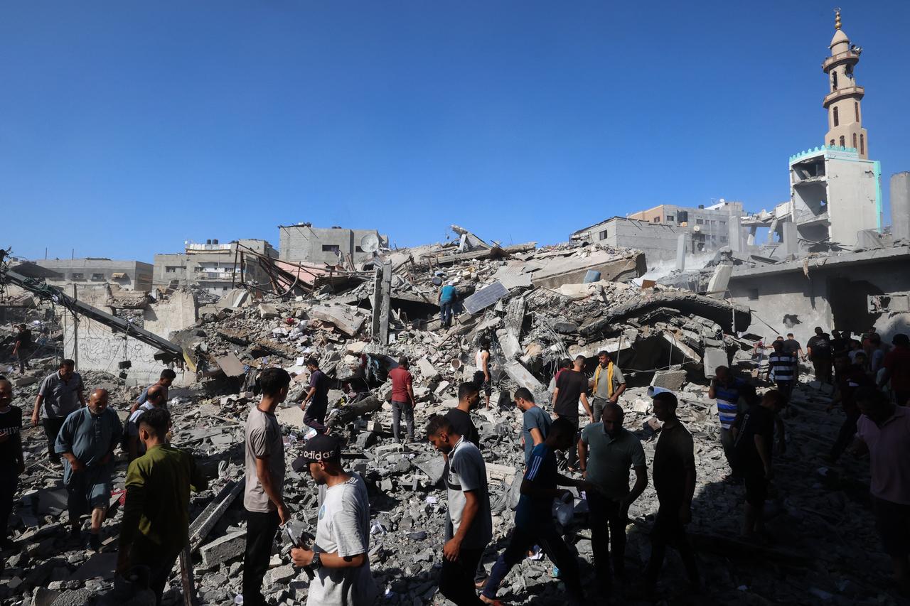 Palestinians inspect the rubble of a house hit in an Israeli strike on the Bureij camp for Palestinian refugees in the central Gaza Strip on June 15, 2025. (AFP Photo)