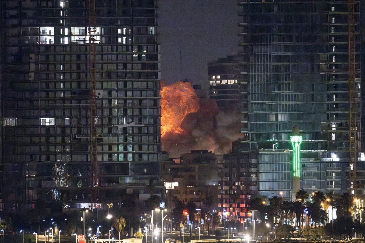 Smoke and flame rise after Iranian strikes hit a building as Irans ongoing retaliatory attacks with ballistic missiles towards Israel are seen from Tel Aviv, Israel on June 16, 2025. (AA Photo)