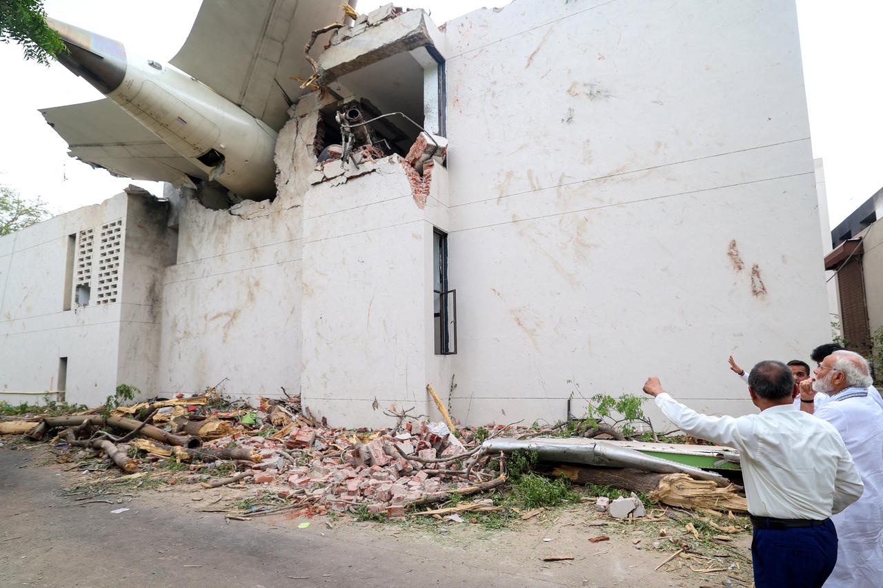 This picture taken and released by the Indian Press Information Bureau (PIB) on June 13, 2025, shows India's Prime Minister Narendra Modi visiting the site after Air India flight 171 crashed in a residential area near the airport in Ahmedabad. (AFP Photo)